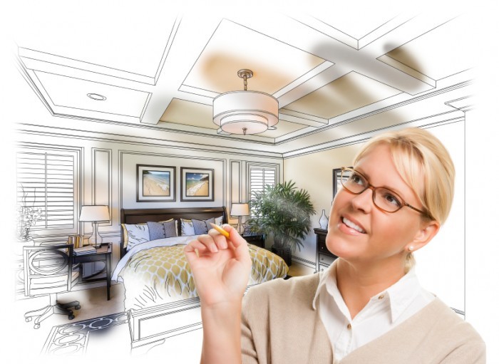 Creative Woman With Pencil Over Custom Bedroom Design Drawing and Photo Combination.